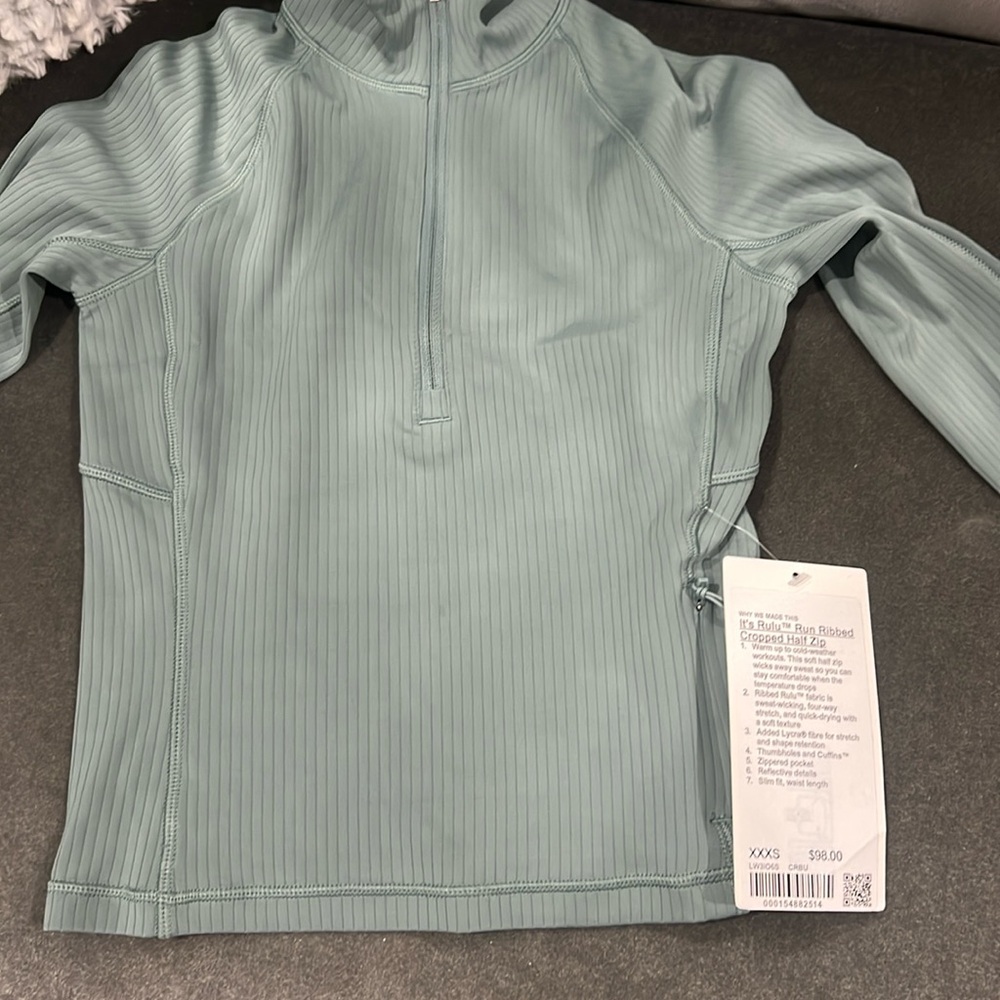 It’s rulu run ribbed cropped half zip in green